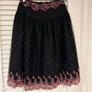 Anna Sui black skirt with pink and red detail.
